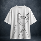 A white short-sleeve t-shirt with a black line art graphic of two hands with long black nails, shown against a dark textured gray background.
