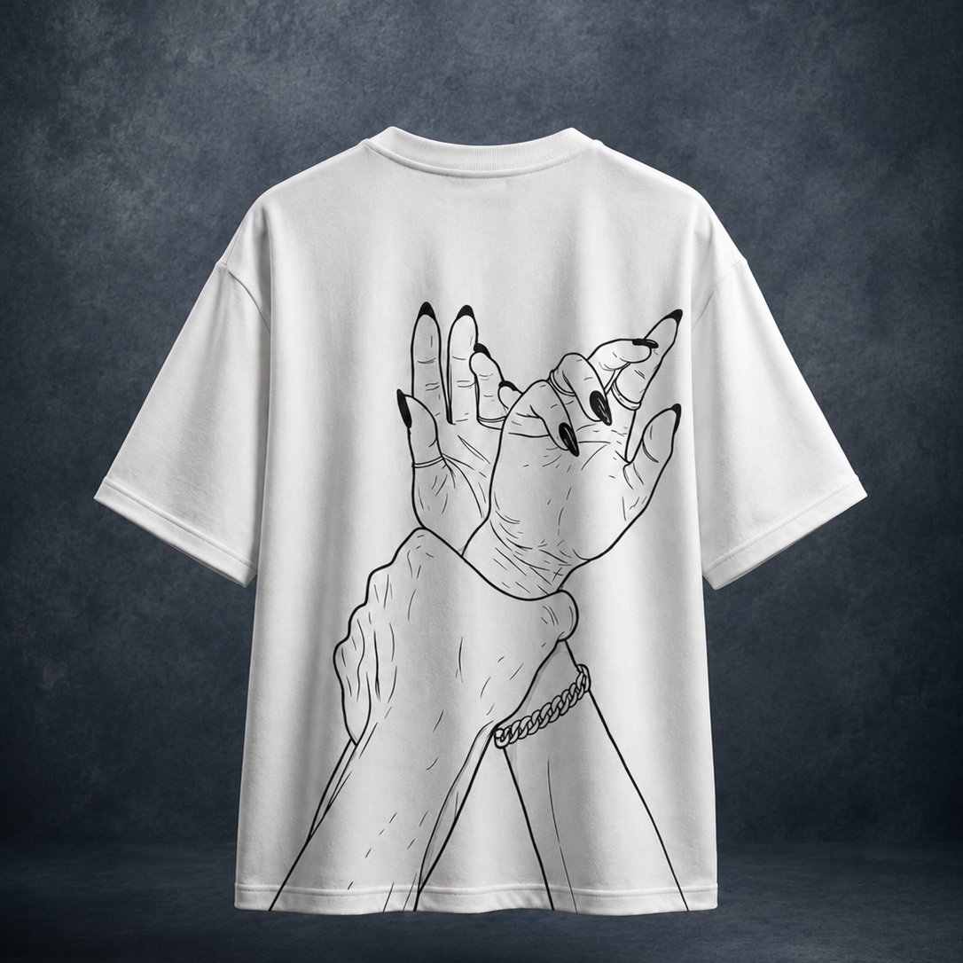 A white short-sleeve t-shirt with a black line art graphic of two hands with long black nails, shown against a dark textured gray background.